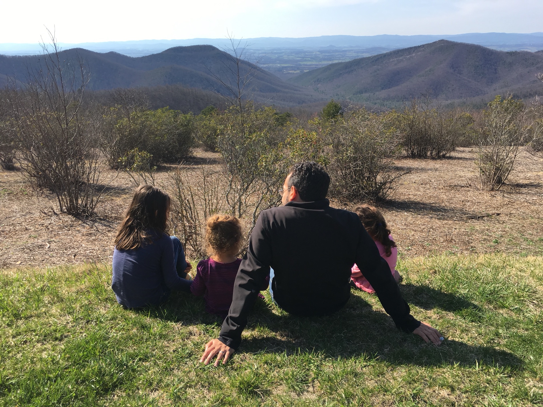 Damian and his three daughters overlooking the valley